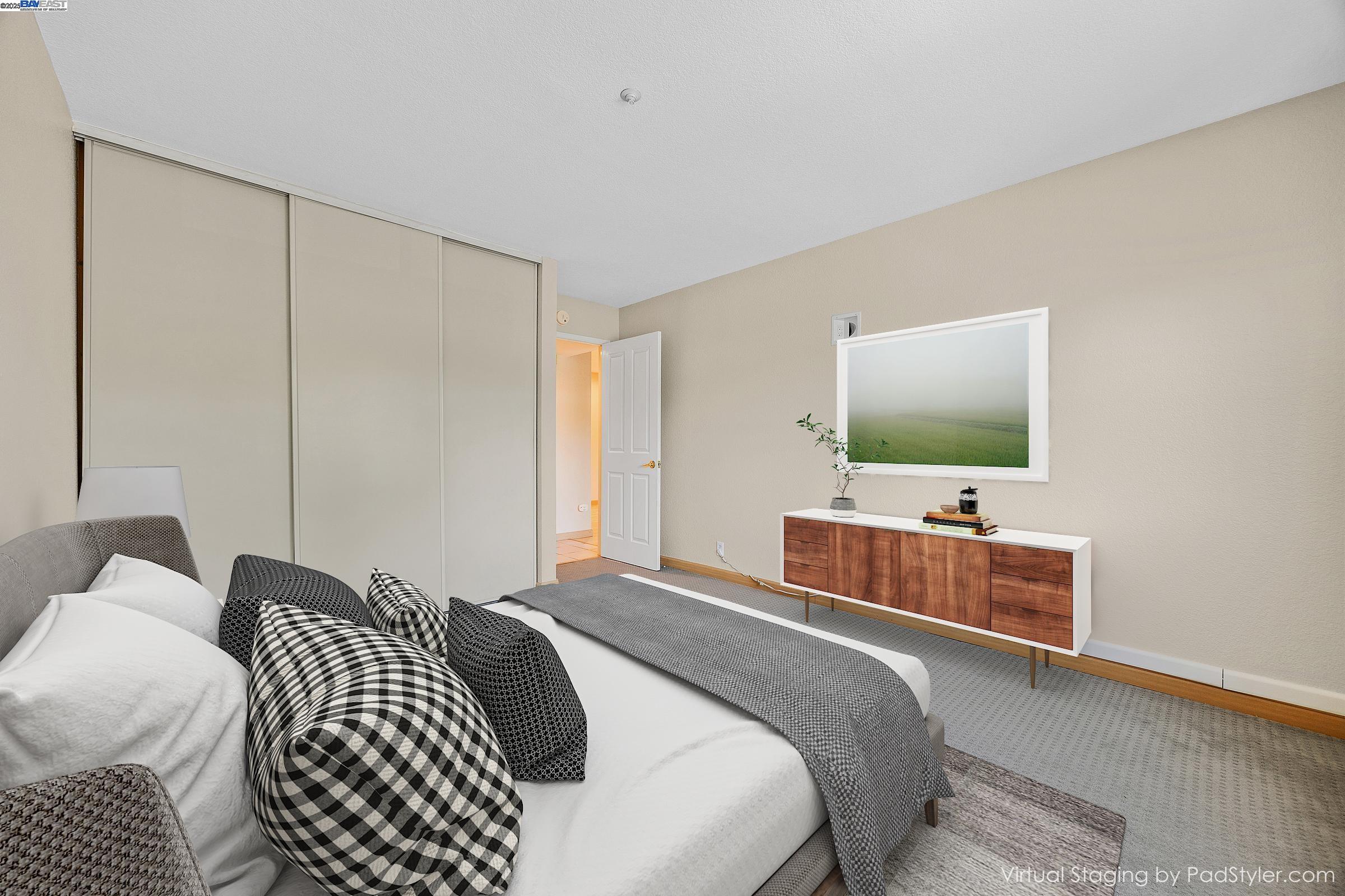 1308 Walden Road, Unit 37 Walnut Creek, CA 94597 - Photo 11 of 27 a bedroom with a bed and a flat screen tv