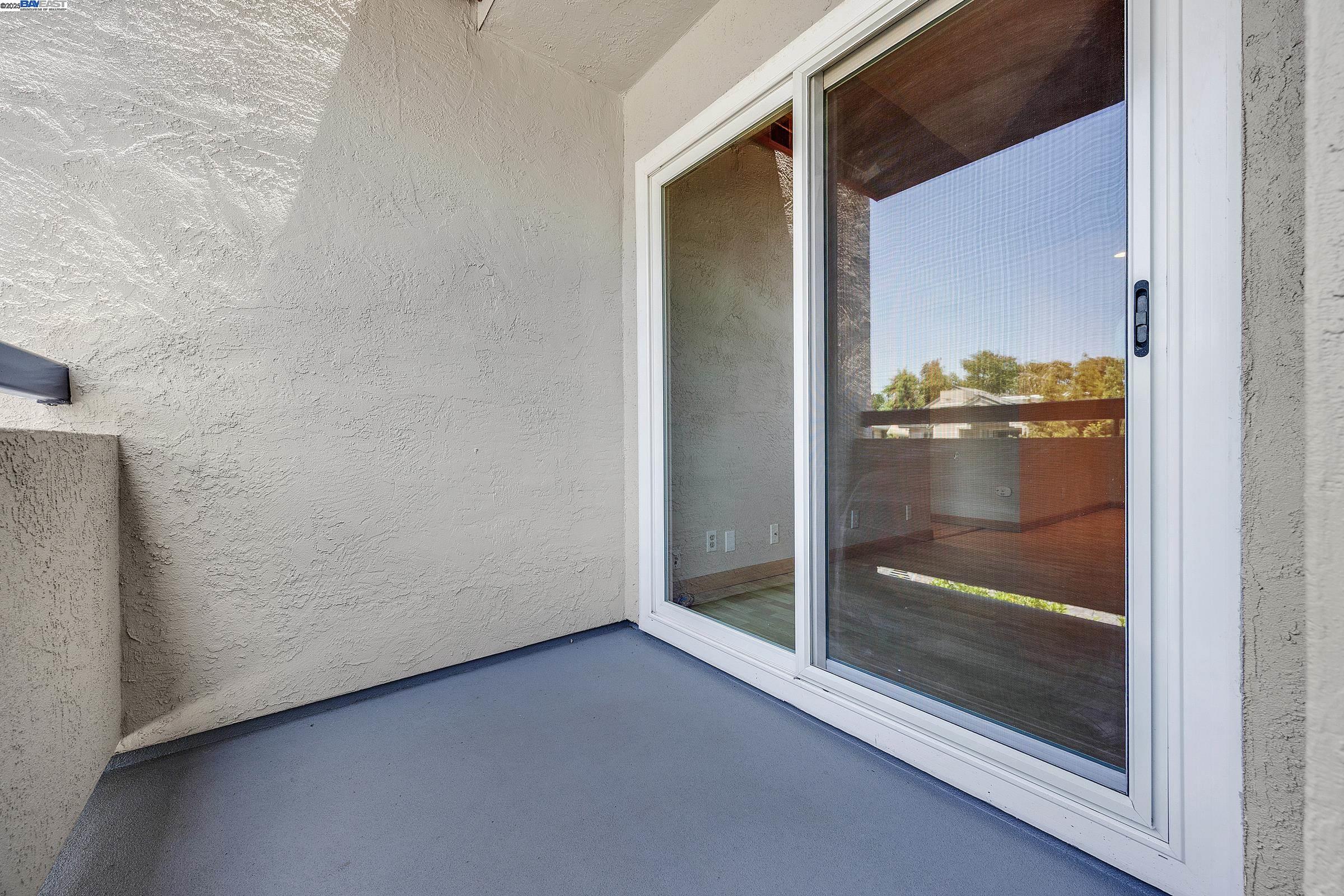 1308 Walden Road, Unit 37 Walnut Creek, CA 94597 - Photo 16 of 27 a view of a glass door and window in an empty room