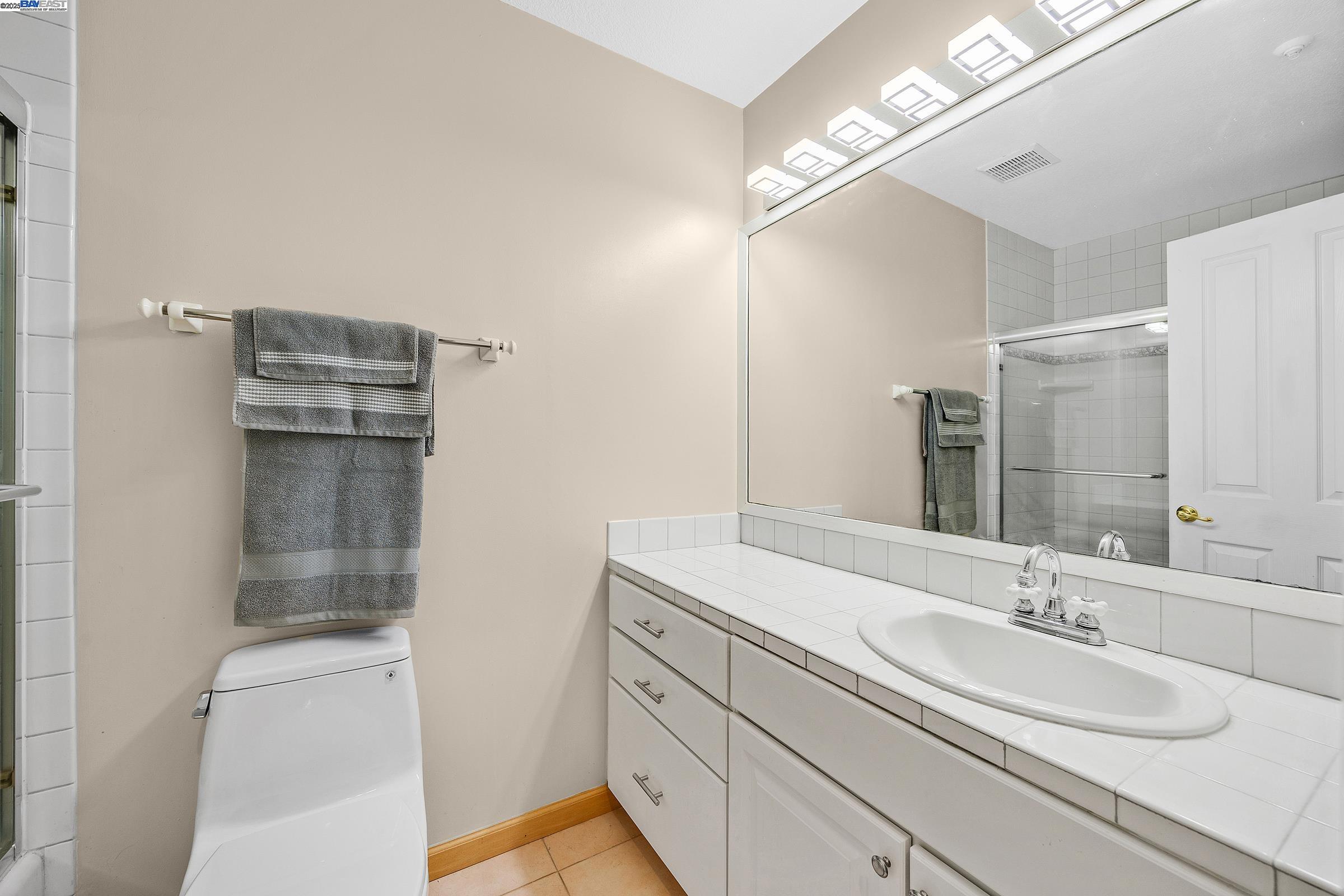 1308 Walden Road, Unit 37 Walnut Creek, CA 94597 - Photo 17 of 27 a bathroom with a sink and a mirror