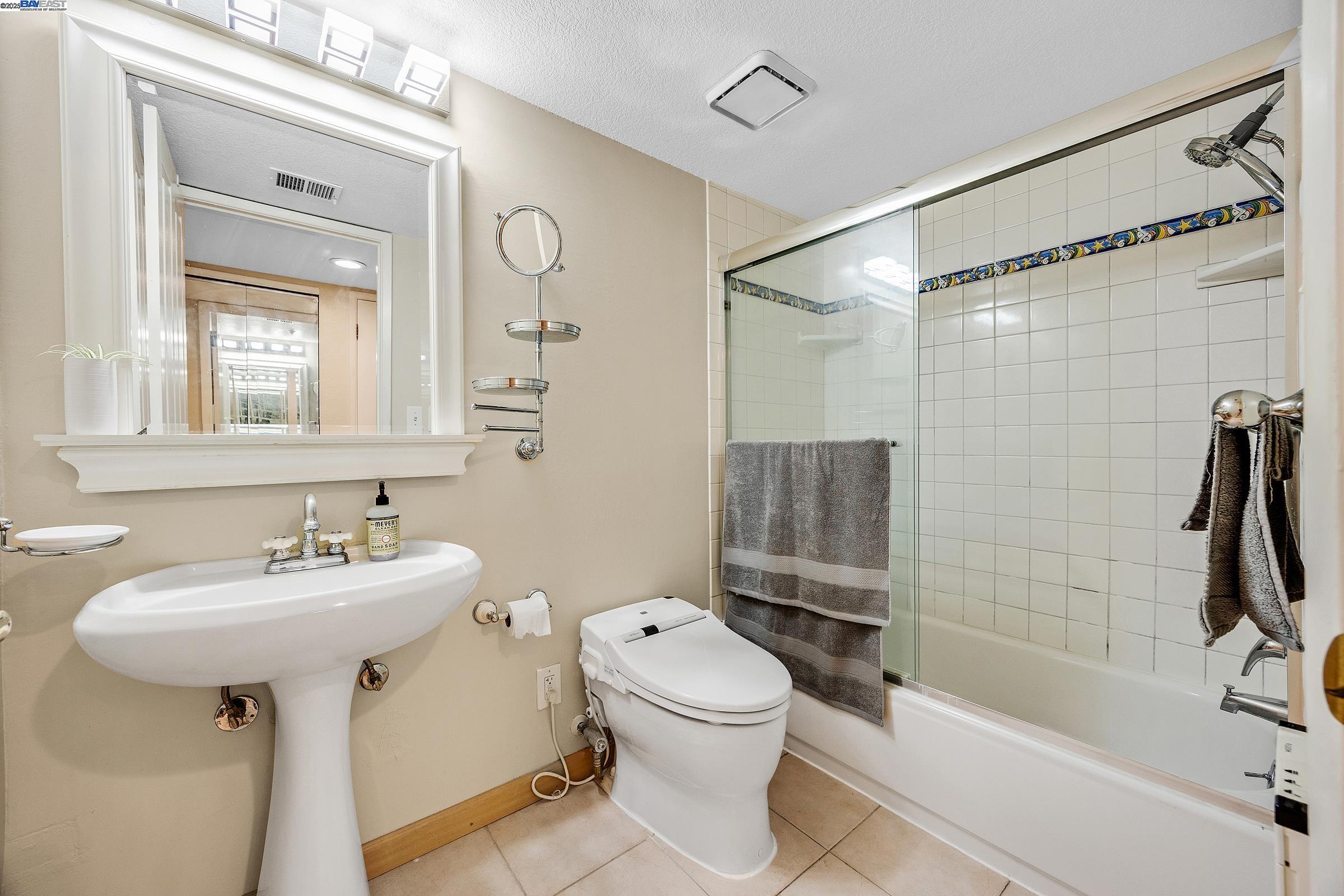 1308 Walden Road, Unit 37 Walnut Creek, CA 94597 - Photo 20 of 27 a bathroom with a sink toilet tub and shower