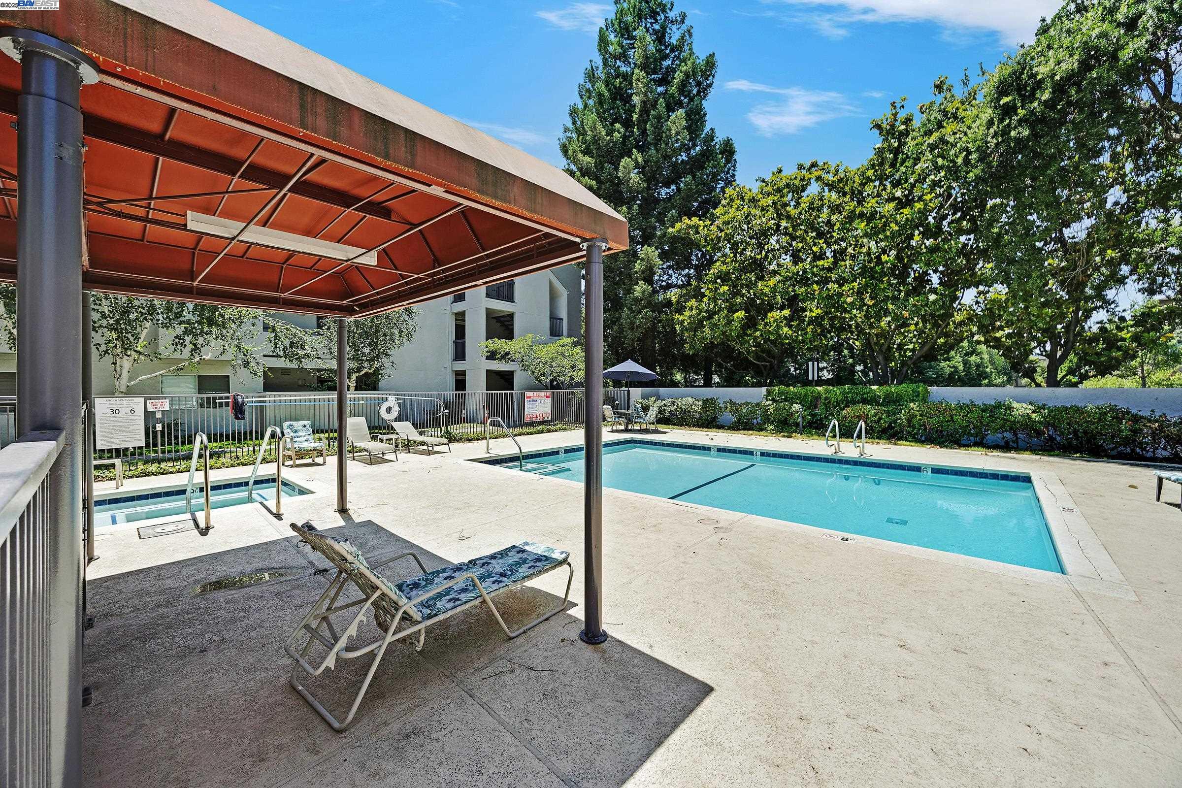 1308 Walden Road, Unit 37 Walnut Creek, CA 94597 - Photo 23 of 27 a swimming pool with outdoor seating and yard