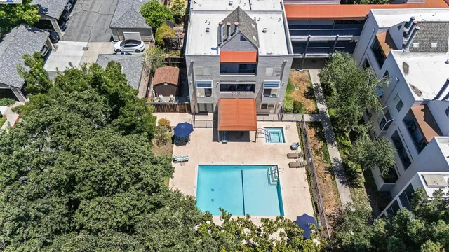 an aerial view of a house with a yard