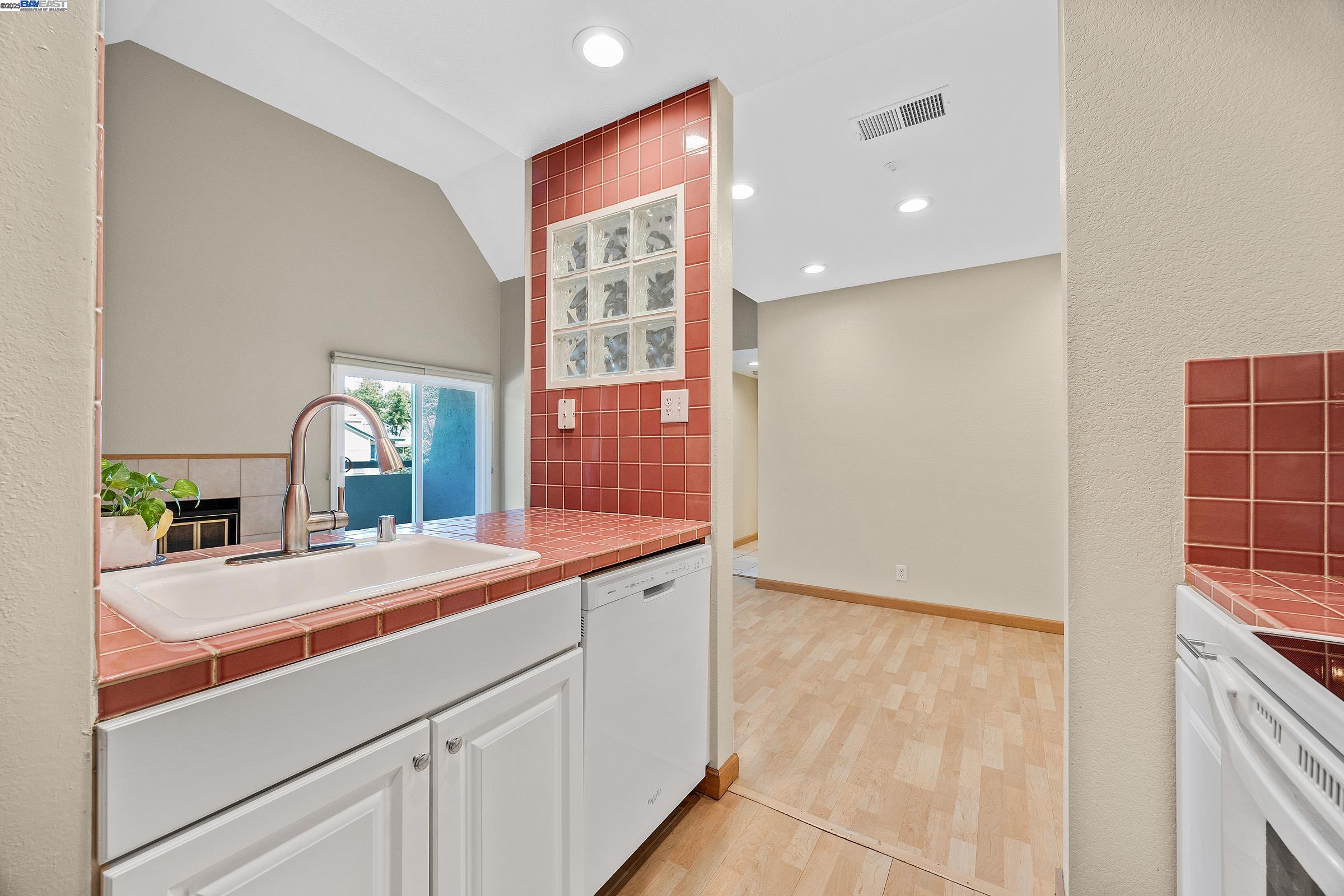 1308 Walden Road, Unit 37 Walnut Creek, CA 94597 - Photo 7 of 27 a room with a sink and a mirror