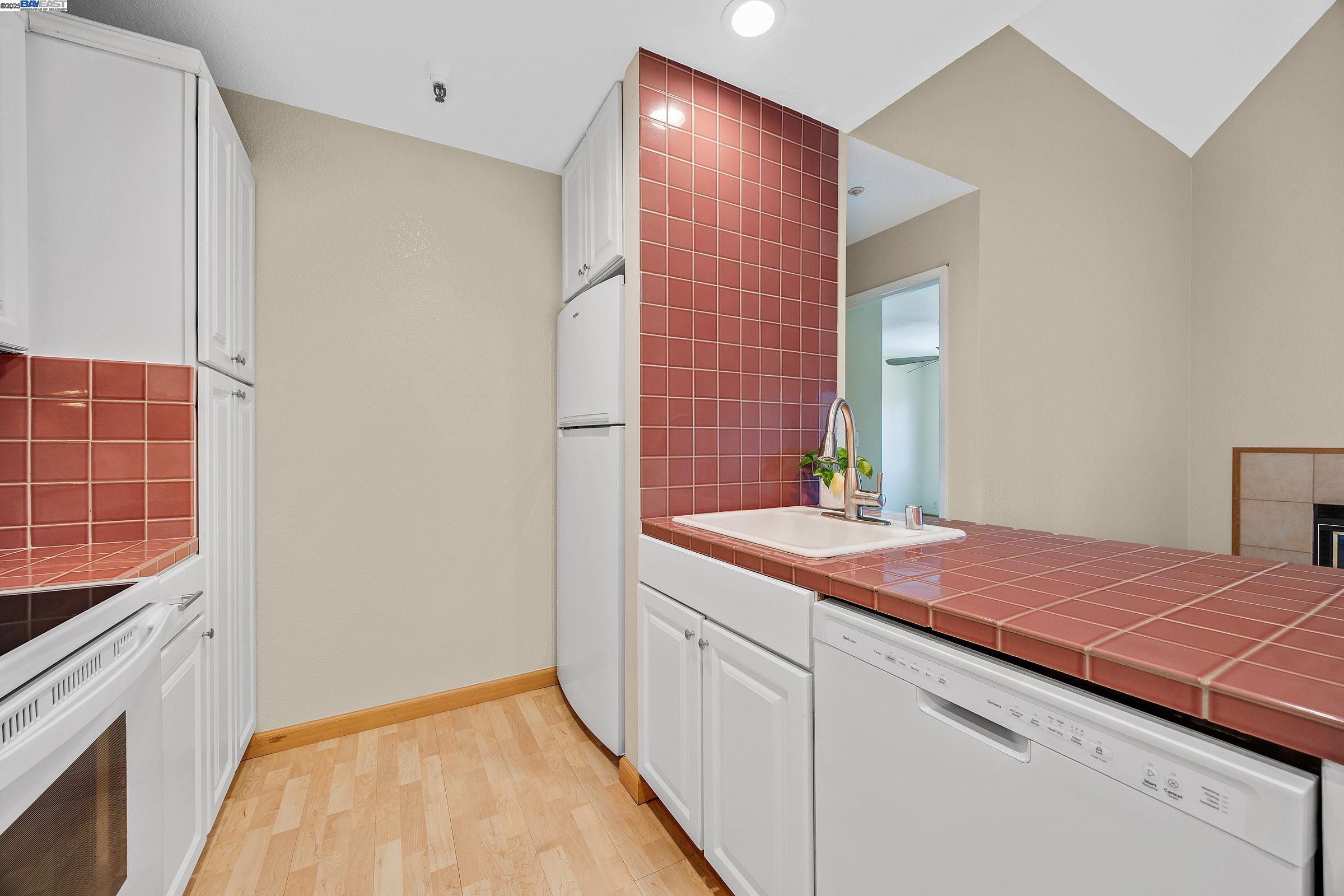 1308 Walden Road, Unit 37 Walnut Creek, CA 94597 - Photo 9 of 27 a bathroom with a sink and a mirror