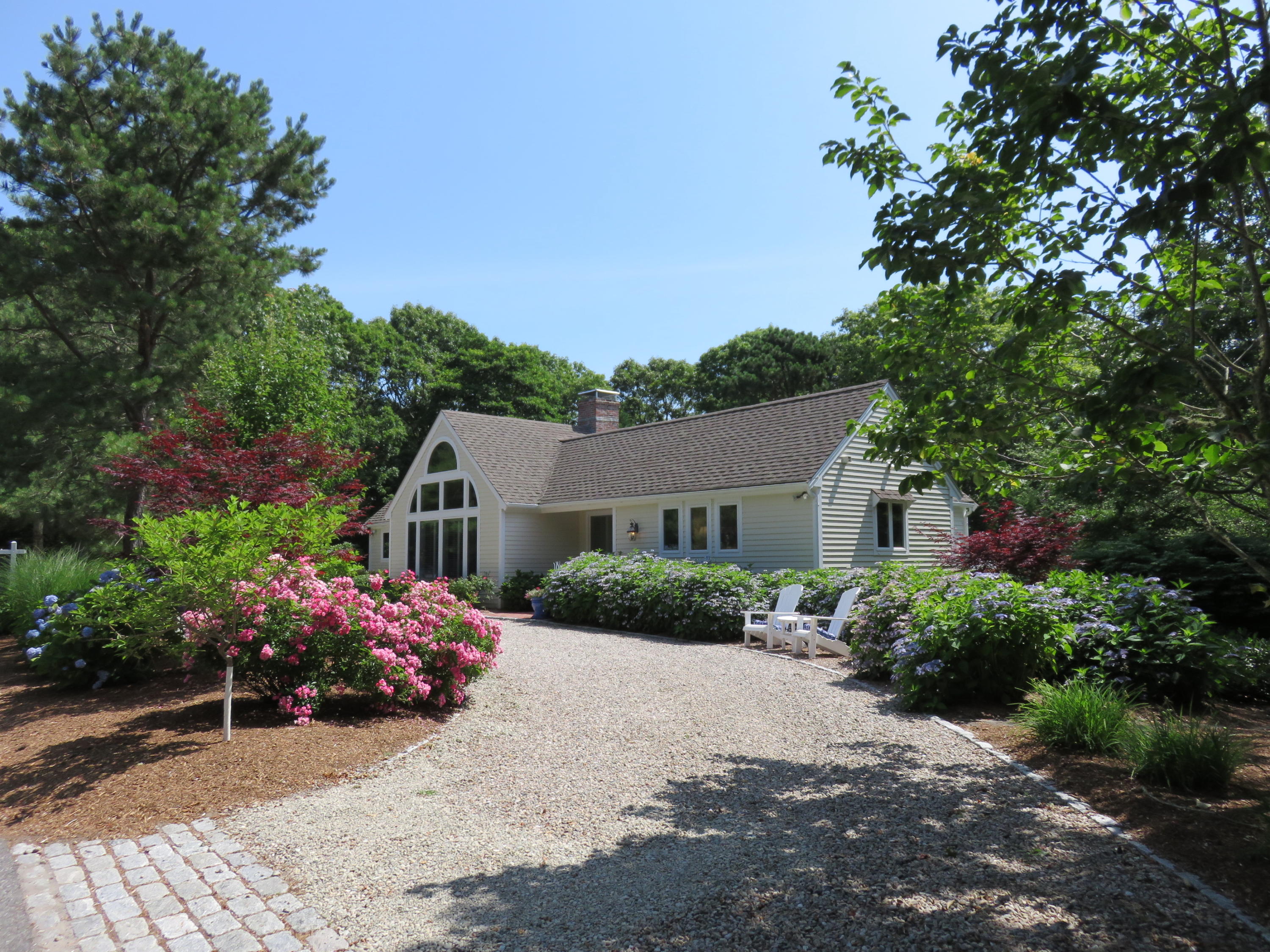 a view of a house with a garden
