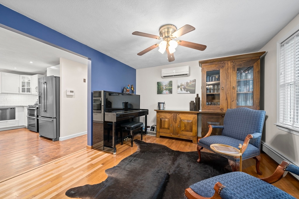 18 Sunnybrook Lane Canton, MA 02021 - Photo 11 of 40 a living room with furniture ceiling fan and a window