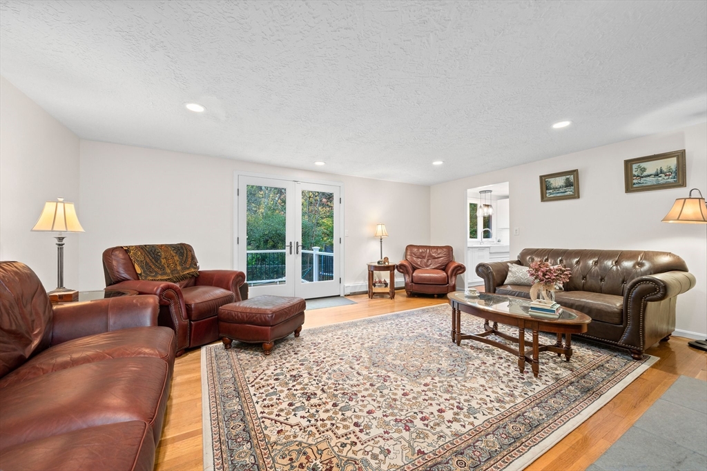 18 Sunnybrook Lane Canton, MA 02021 - Photo 15 of 40 a living room with furniture couches and a large window