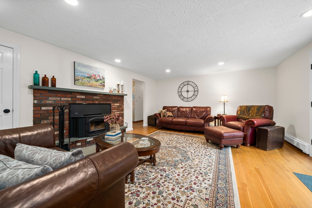 18 Sunnybrook Lane Canton, MA 02021 - Photo 16 of 40 a living room with furniture and a fireplace
