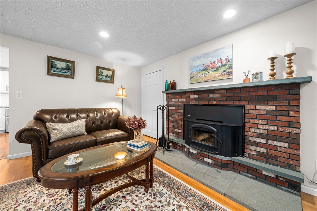 18 Sunnybrook Lane Canton, MA 02021 - Photo 17 of 40 a living room with furniture and a fireplace