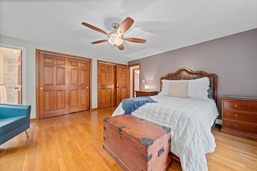18 Sunnybrook Lane Canton, MA 02021 - Photo 19 of 40 a bedroom with a bed and wooden floor