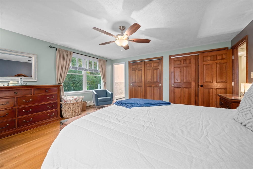18 Sunnybrook Lane Canton, MA 02021 - Photo 20 of 40 a bedroom with a large bed and a window