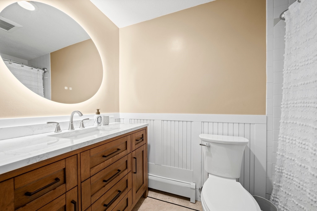 18 Sunnybrook Lane Canton, MA 02021 - Photo 24 of 40 a bathroom with a granite countertop toilet sink mirror and vanity