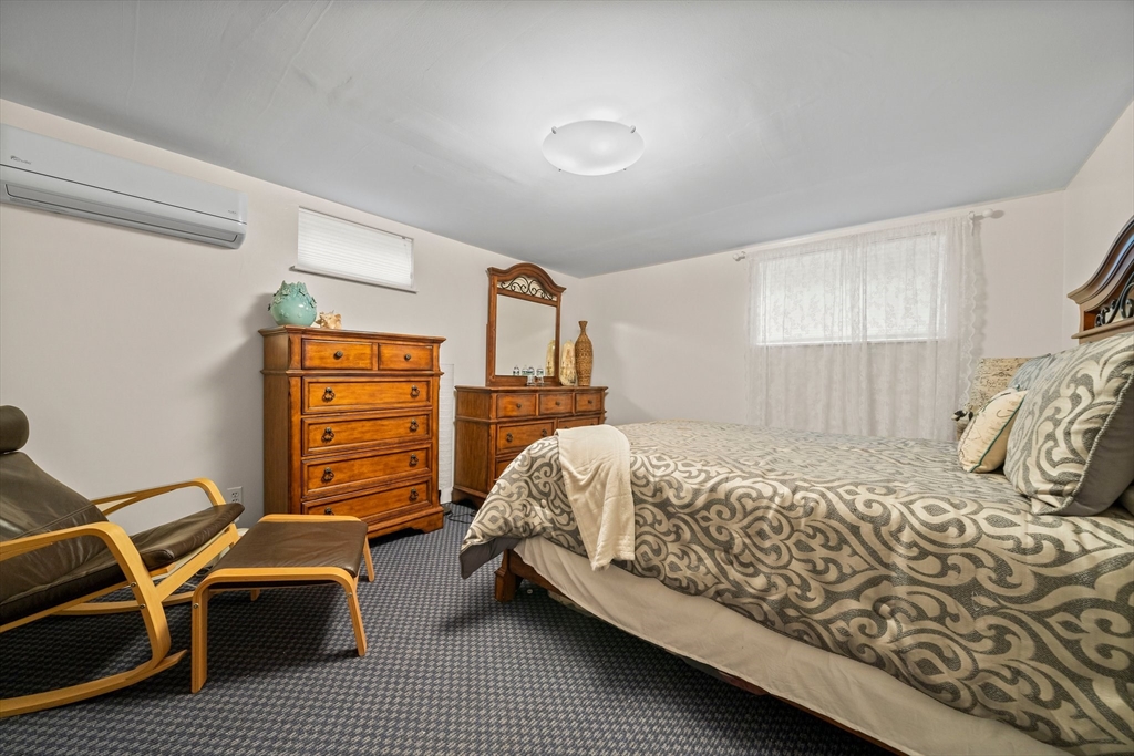 18 Sunnybrook Lane Canton, MA 02021 - Photo 28 of 40 a bedroom with a bed and a table