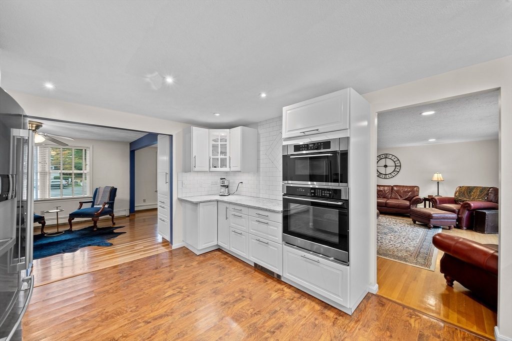 18 Sunnybrook Lane Canton, MA 02021 - Photo 8 of 40 a kitchen with stainless steel appliances kitchen island granite countertop a stove and a sink