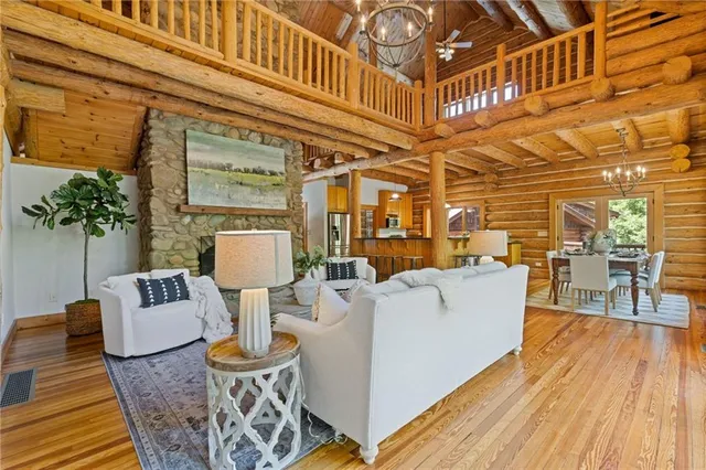 a spacious bathroom with a granite countertop sink and a large mirror