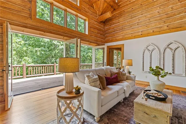 a dining room with furniture and wooden floor