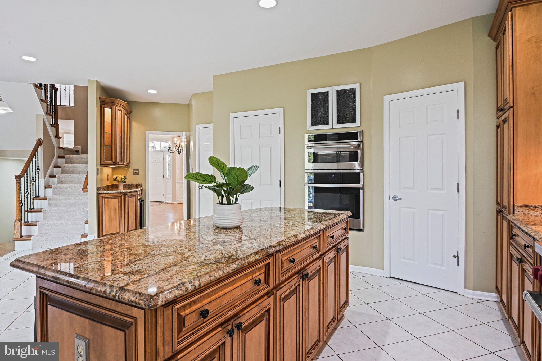 1831 Beulah Road Vienna, VA 22182 - Photo 13 of 96 a kitchen with stainless steel appliances granite countertop a sink and a refrigerator