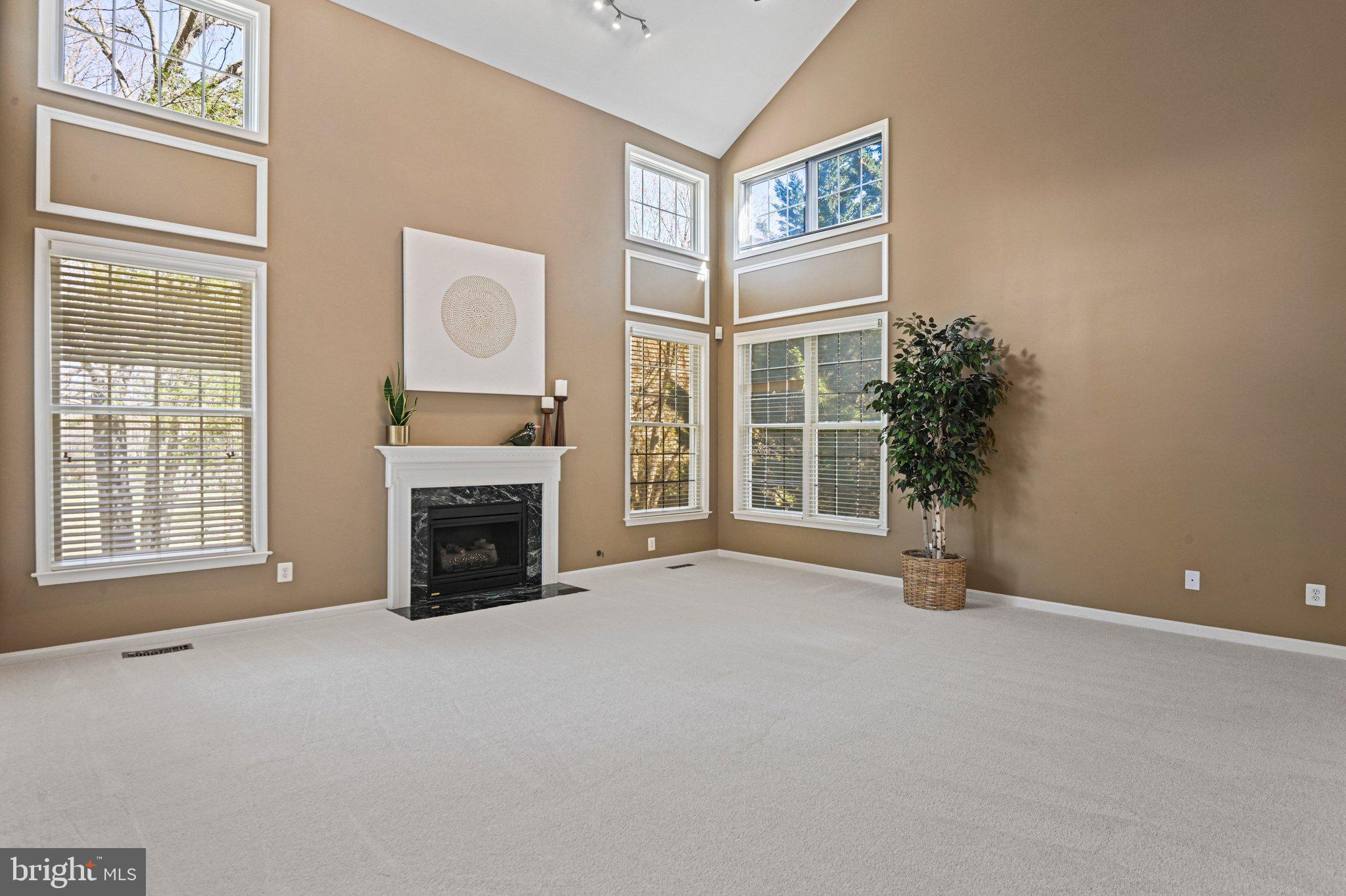 1831 Beulah Road Vienna, VA 22182 - Photo 21 of 96 a view of an empty room with a fireplace and a window