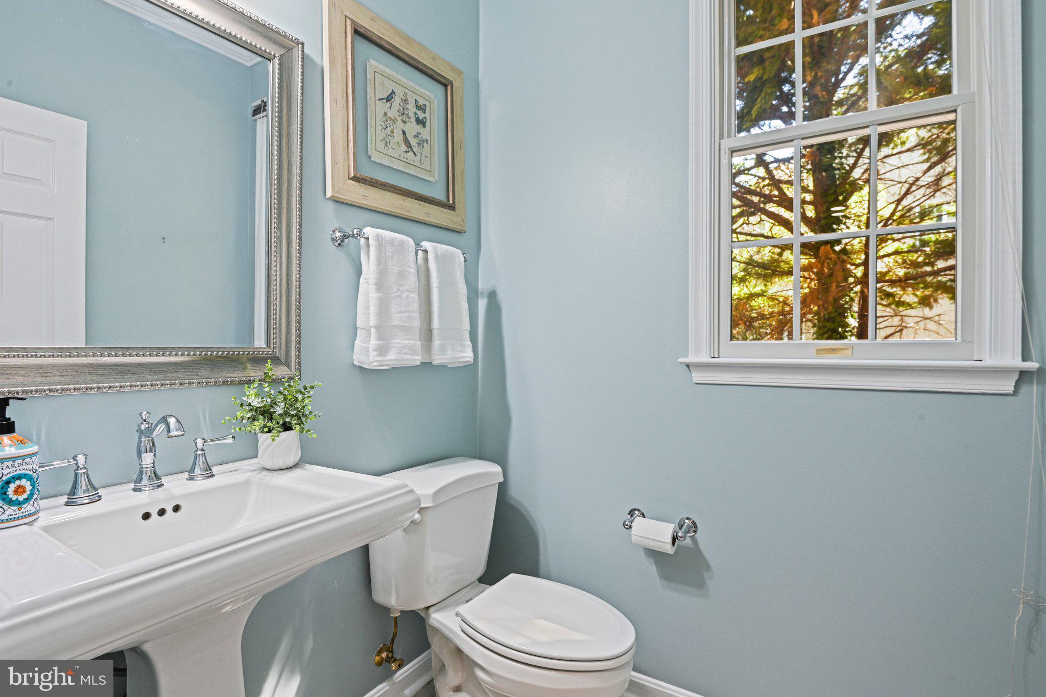 1831 Beulah Road Vienna, VA 22182 - Photo 24 of 96 a white toilet sitting next to a bathroom sink