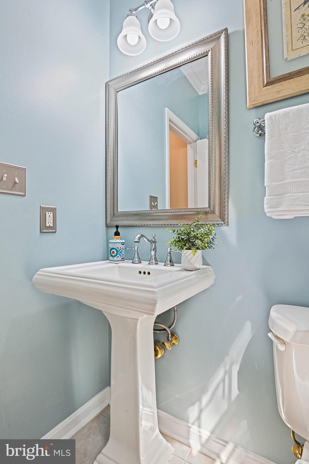 1831 Beulah Road Vienna, VA 22182 - Photo 25 of 96 a bathroom with a sink and a mirror