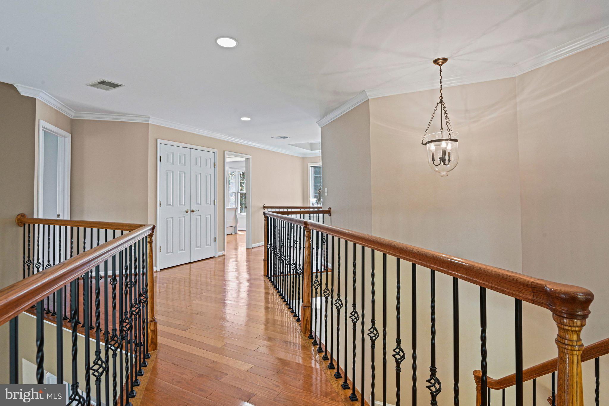 1831 Beulah Road Vienna, VA 22182 - Photo 40 of 96 a view of a hallway with wooden floor and windows
