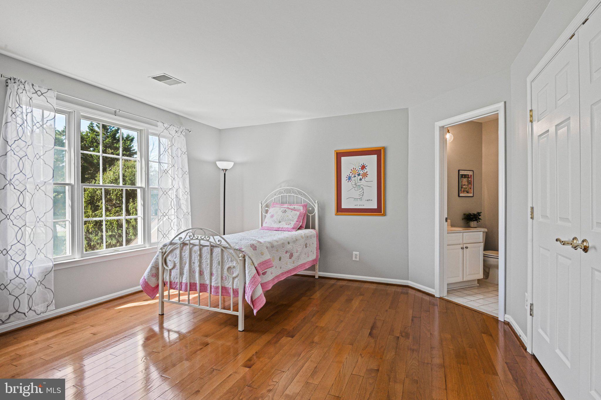 1831 Beulah Road Vienna, VA 22182 - Photo 43 of 96 a bedroom with a bed and a large window