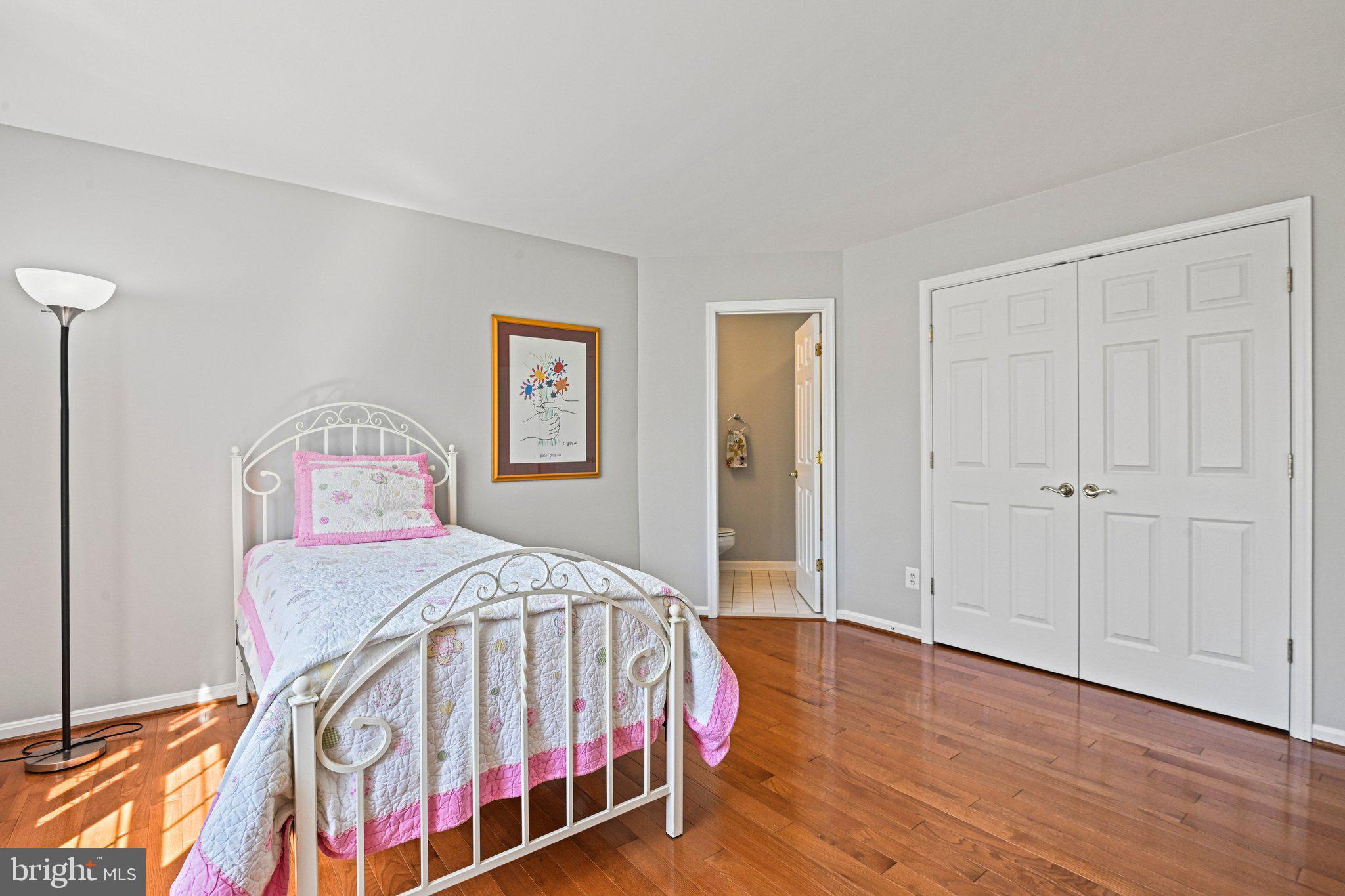 1831 Beulah Road Vienna, VA 22182 - Photo 44 of 96 a bedroom with a bed and a painting on the wall