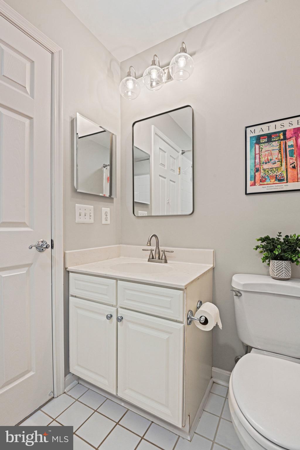 1831 Beulah Road Vienna, VA 22182 - Photo 47 of 96 a bathroom with a toilet sink and mirror