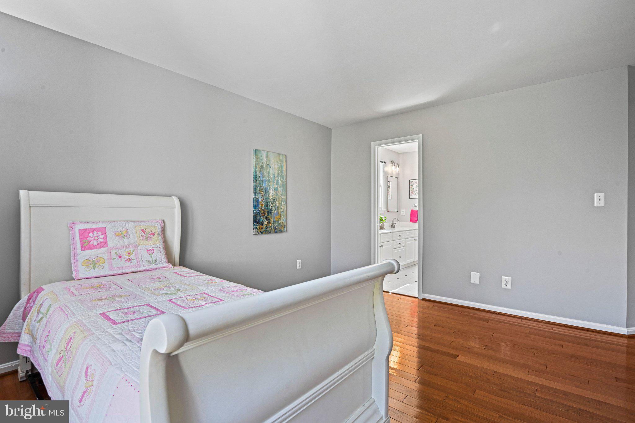 1831 Beulah Road Vienna, VA 22182 - Photo 56 of 96 a bedroom with a large bed and a potted plant