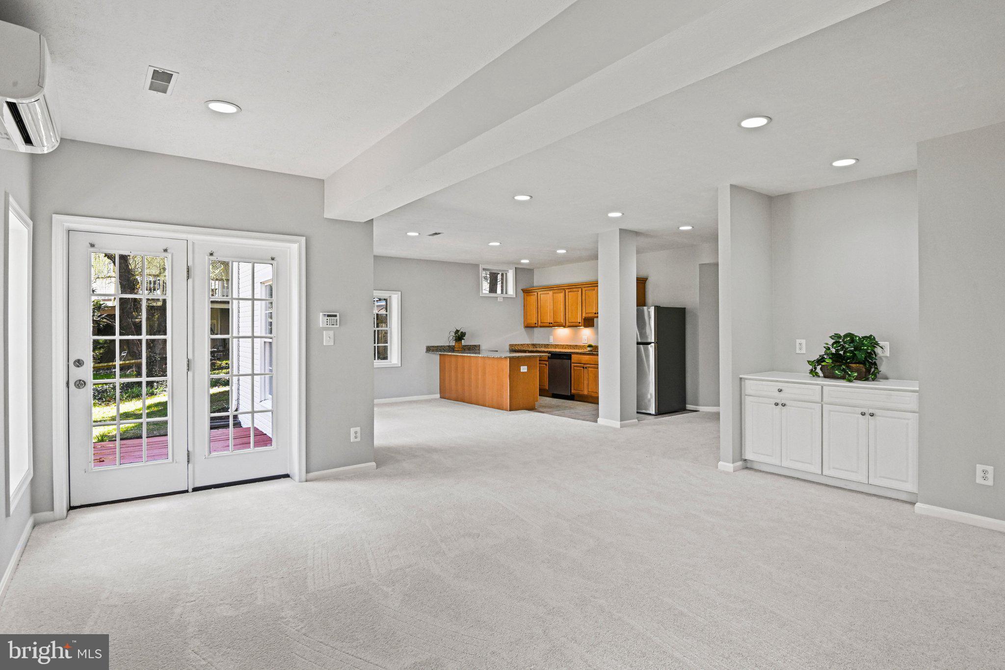 1831 Beulah Road Vienna, VA 22182 - Photo 62 of 96 a large white kitchen with stainless steel appliances kitchen island a large counter top and a refrigerator