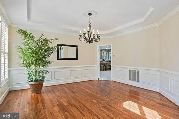 a kitchen with stainless steel appliances granite countertop a stove and a refrigerator