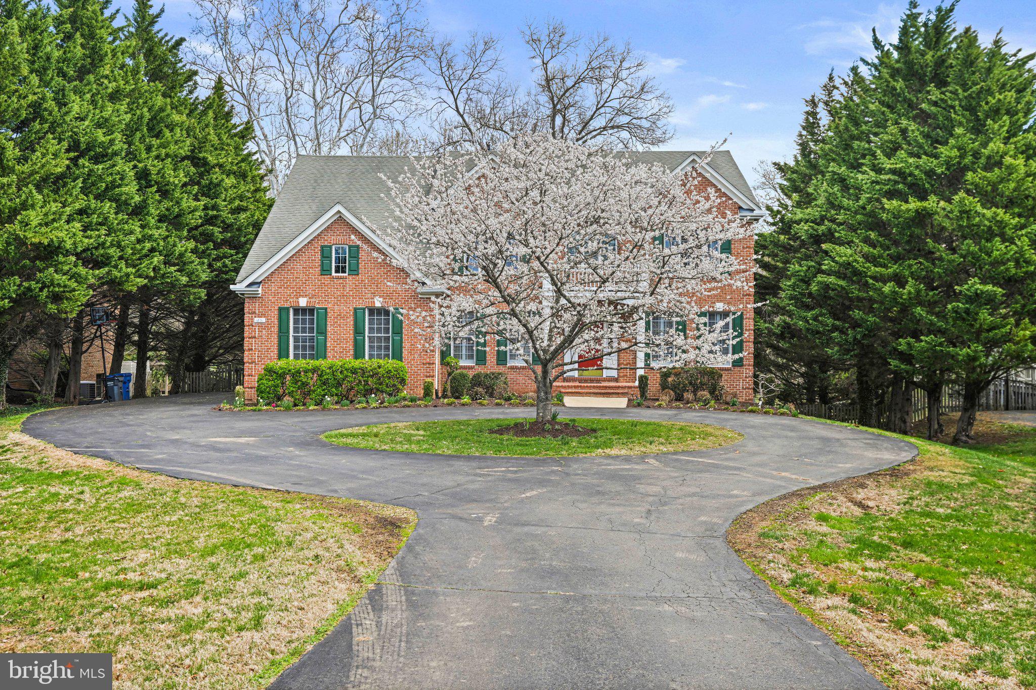 1831 Beulah Road Vienna, VA 22182 - Photo 95 of 96 a view of a house with a yard and large trees