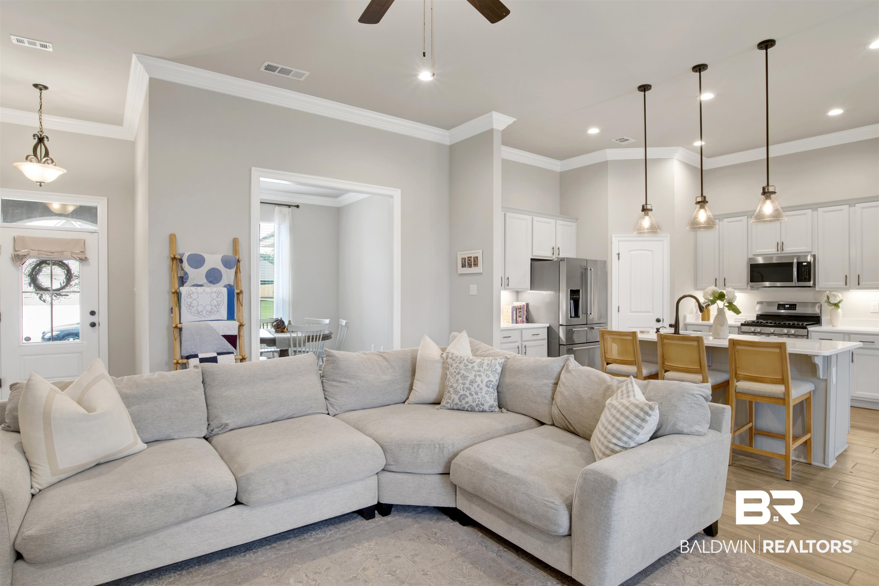 30770 Marcel Boulevard Spanish Fort, AL 36527 - Photo 5 of 23 Living room with light wood-type flooring, ceiling fan, a wealth of natural light, and crown molding