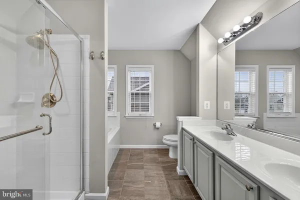 a bathroom with a sink double vanity and a mirror