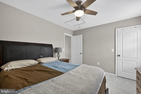 a bedroom with a bed and a tv