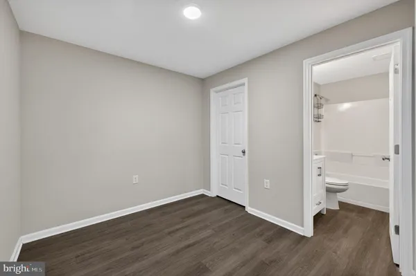 a bathroom with a sink toilet tub and shower