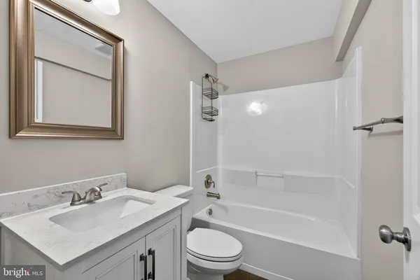 a view of a house with swimming pool and sitting area