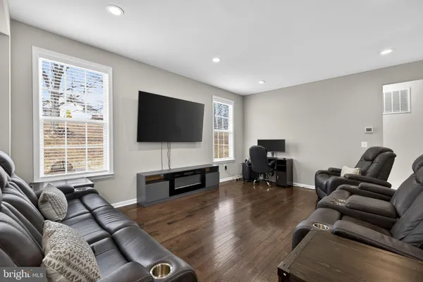 a kitchen with stainless steel appliances granite countertop a refrigerator a stove microwave and sink