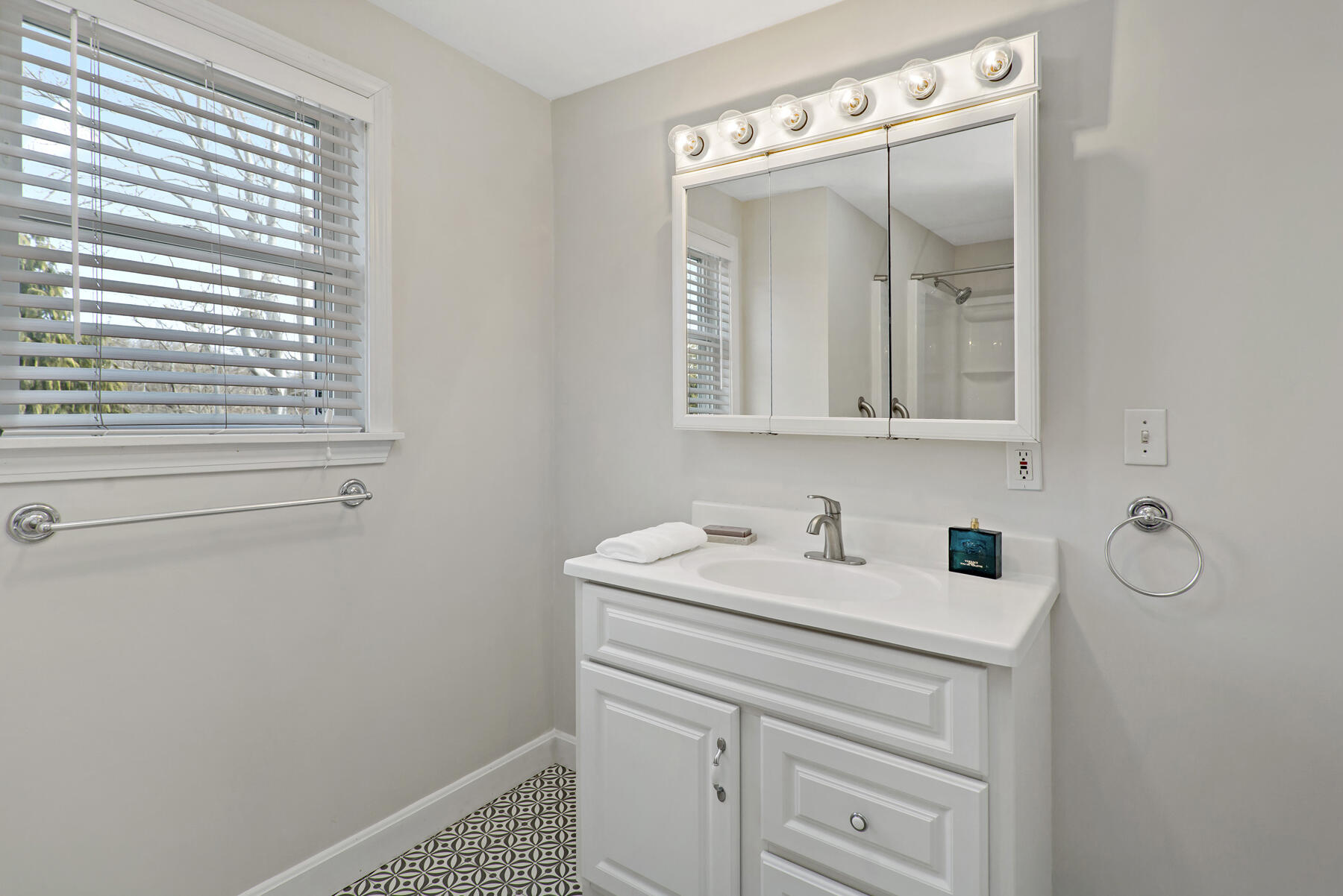 20 Evergreen Street Onset, MA 02558 - Photo 21 of 26 a bathroom with a sink a vanity and a mirror