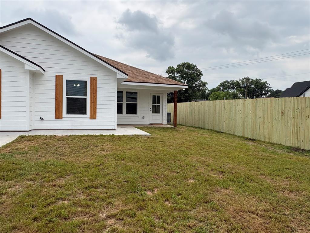 204 North Wiebusch Street Riesel, TX 76682 - Photo 27 of 33 a front view of a house with garden