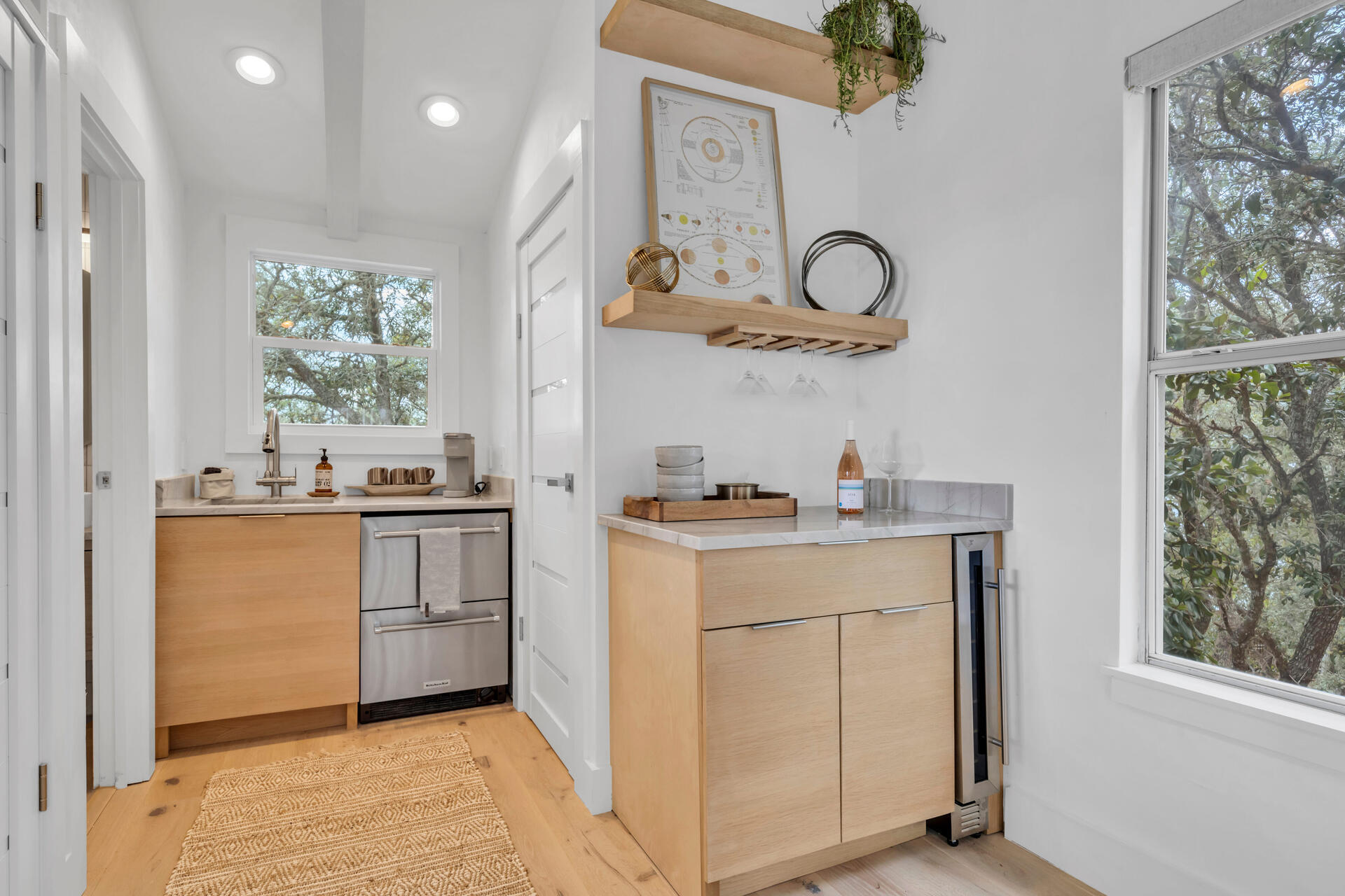 6296 West County Highway 30A Santa Rosa Beach, FL 32459 - Photo 15 of 121 a kitchen with a sink cabinets and a window