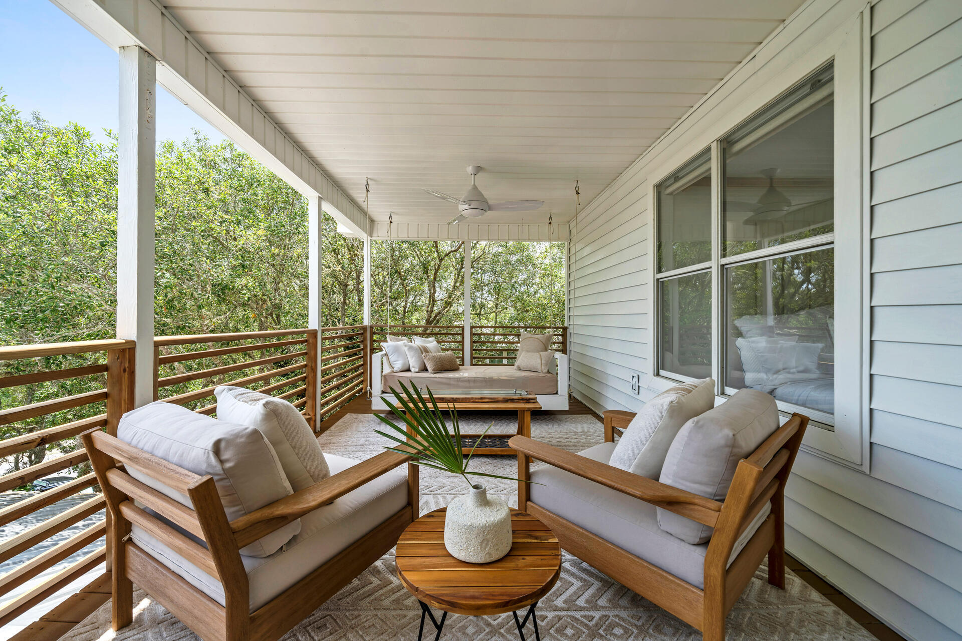 6296 West County Highway 30A Santa Rosa Beach, FL 32459 - Photo 22 of 121 a outdoor living space with furniture and a potted plant