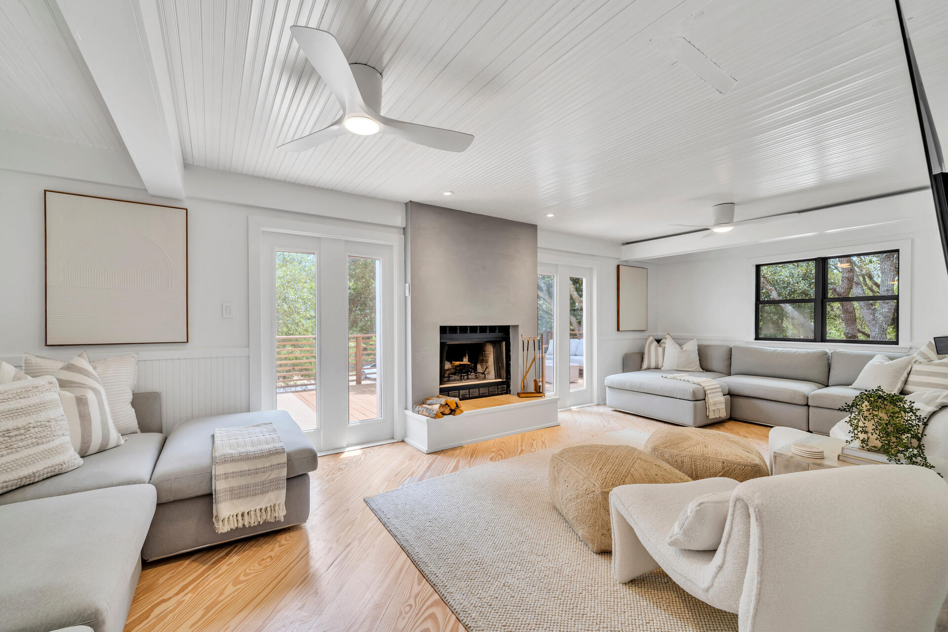 6296 West County Highway 30A Santa Rosa Beach, FL 32459 - Photo 30 of 121 a living room with furniture and a fireplace