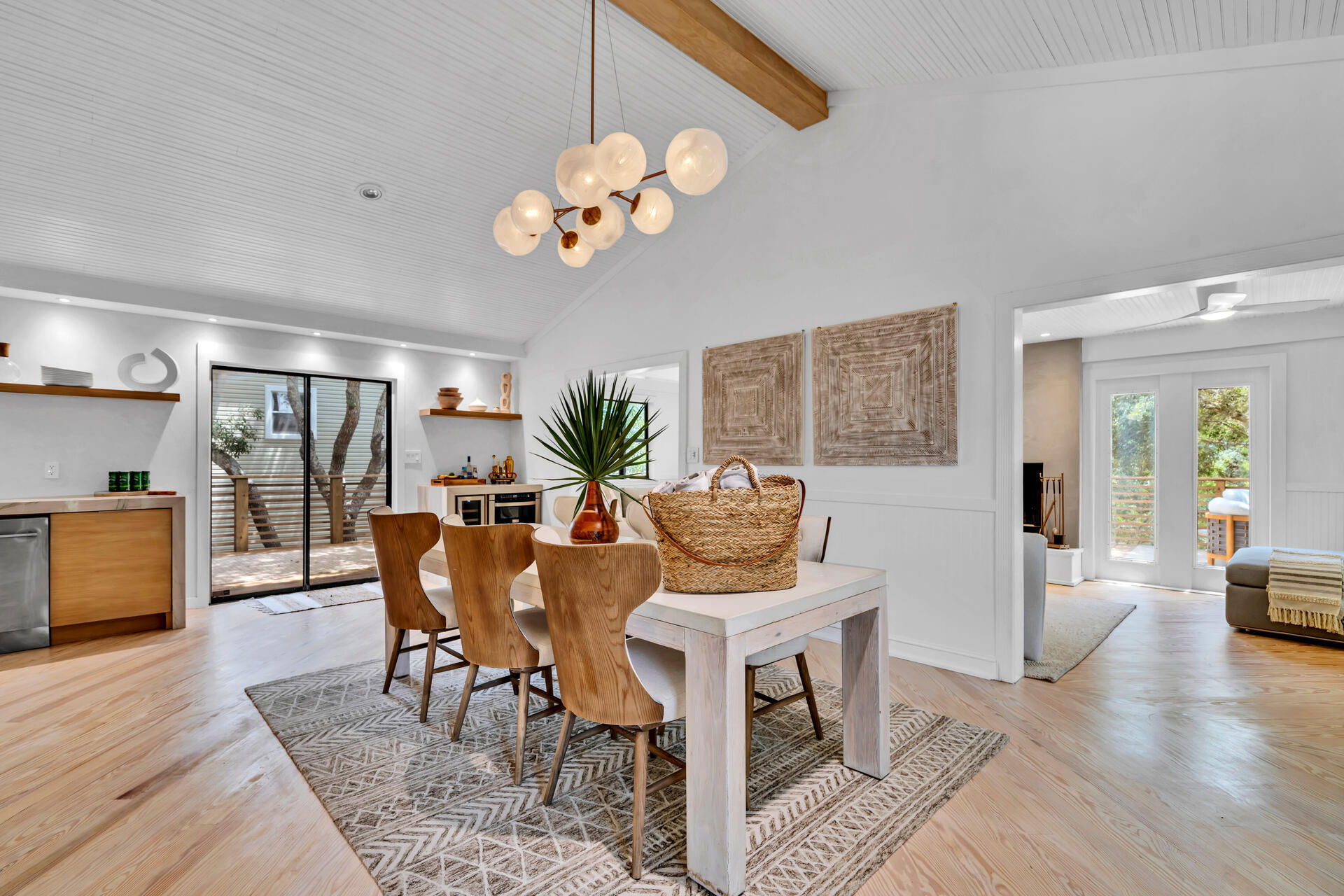 6296 West County Highway 30A Santa Rosa Beach, FL 32459 - Photo 3 of 121 a view of a dining room with furniture wooden floor and chandelier