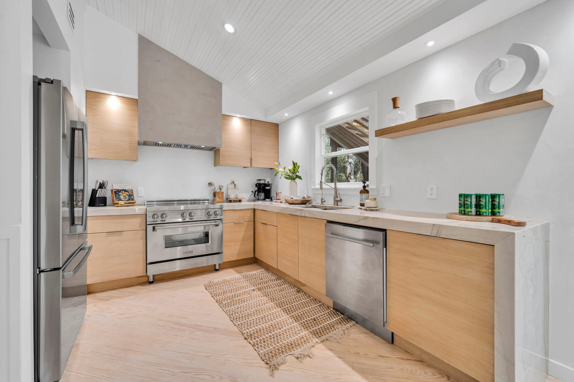 6296 West County Highway 30A Santa Rosa Beach, FL 32459 - Photo 34 of 121 a kitchen with a sink window and stainless steel appliances