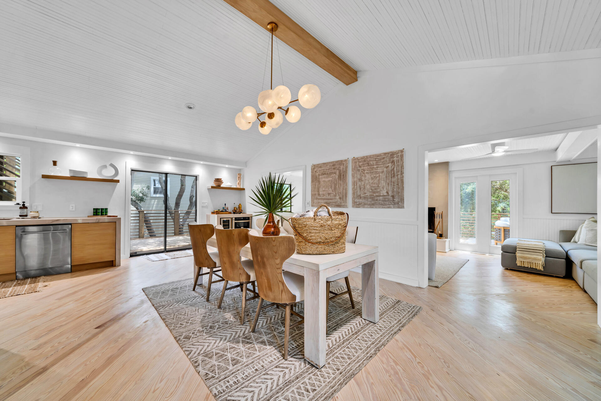 6296 West County Highway 30A Santa Rosa Beach, FL 32459 - Photo 48 of 121 a living room with furniture a dining table and a fireplace
