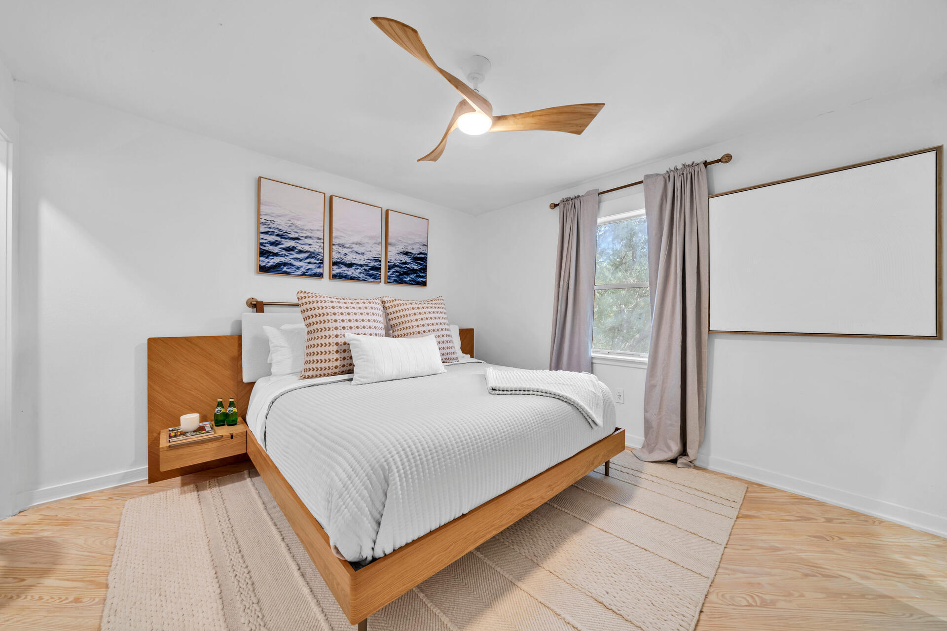 6296 West County Highway 30A Santa Rosa Beach, FL 32459 - Photo 61 of 121 a bedroom with a bed and a painting on the wall