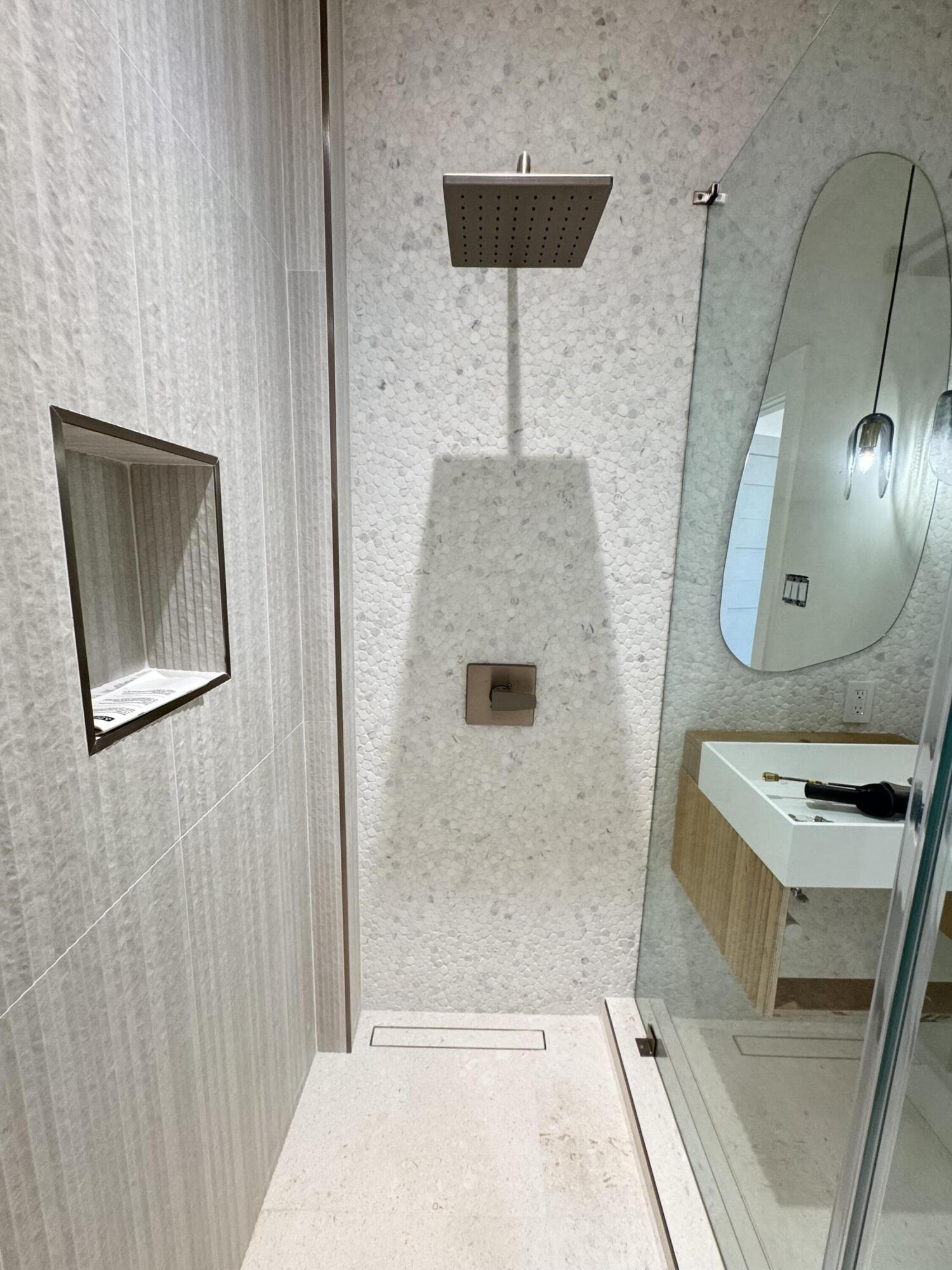 6296 West County Highway 30A Santa Rosa Beach, FL 32459 - Photo 94 of 121 a bathroom with a sink a mirror and vanity