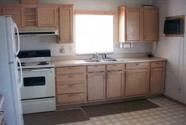 5131 Lateral A Road Wapato, WA 98951 - Photo 2 of 7 a kitchen with a stove microwave and sink