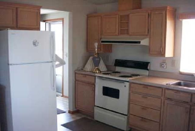 5131 Lateral A Road Wapato, WA 98951 - Photo 3 of 7 a kitchen with a stove and a refrigerator